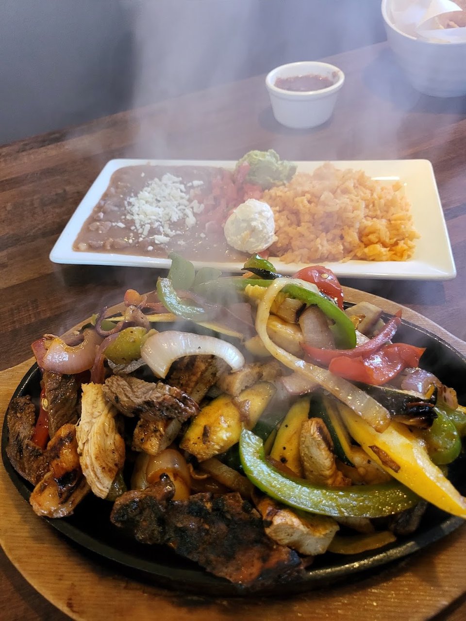 Mexican menu with fajitas and burritos.