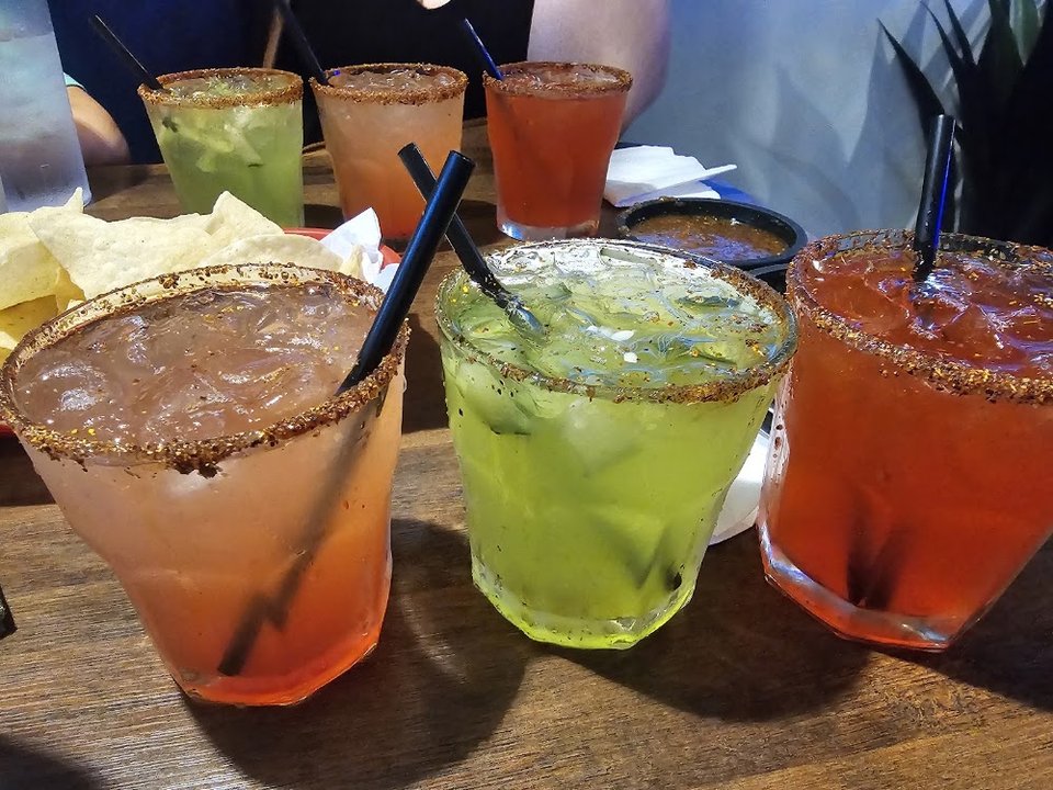 Mexican menu with fajitas and burritos.